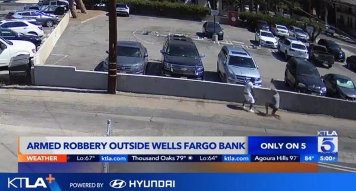 did-bank-employee-tip-off-robber?–-armed-robber-targets-customer-walking-out-of-bank-with-$10,000-cash-in-broad-daylight-heist-(video)