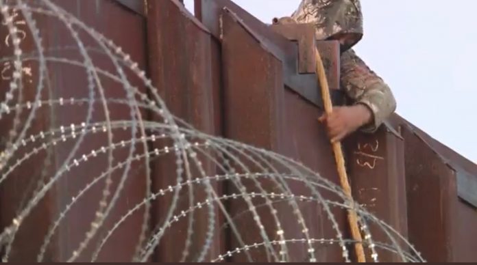 enjoy:-illegal-immigrants-jump-over-southern-border-fence-dressed-in-camoflauge-near-tucson-arizona–-over-a-dozen-in-45-minuites