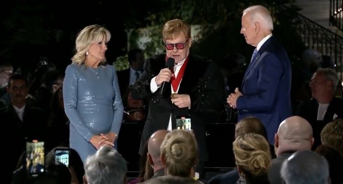 jill-biden-dons-ill-fitting-dress-while-hosting-musical-performance-by-elton-john-(video)