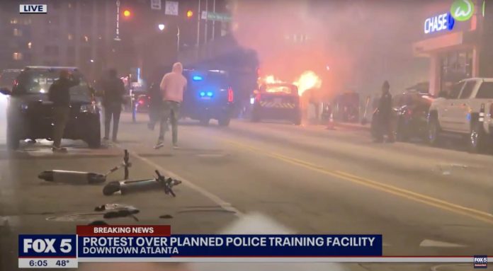 regional-reporter-calls-riot-in-atlanta-“largely-peaceful-protest”-as-police-cruiser-goes-up-in-flames-in-the-background-(video)