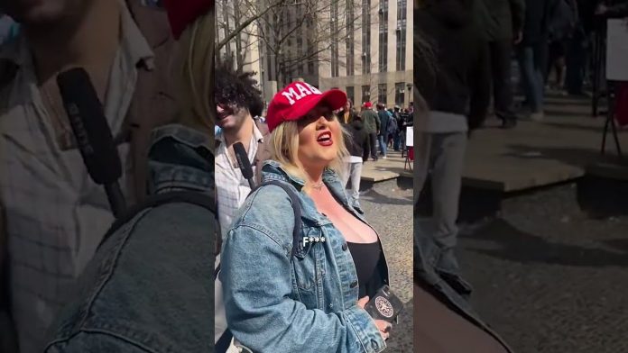 busted:-alleged-trump-supporter-who-crumpled-up-massive-anti-trump-sign-outside-manhattan-courthouse-was-carrying-phone-with-a-satan-sticker–-another-likely-leftist-plant-(video)