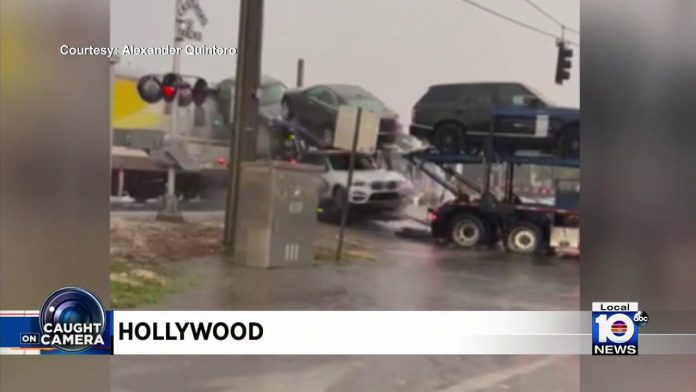 train-rips-18-wheel-car-carrier-in-half-during-florida-storm-(video)