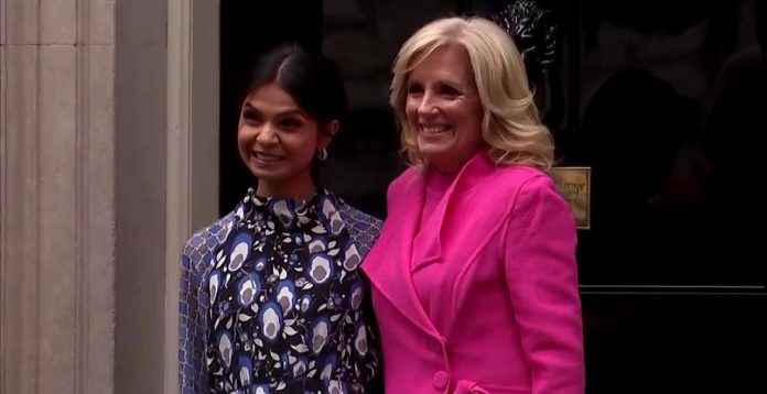 jill-biden-arrives-in-london-in-$1,200-dior-heels-and-bright-pink-outfit-as-feeble-joe-stays-behind-(video)