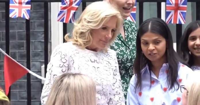 jill-biden-wears-a-bedspread-to-lunch-party-marking-coronation-of-king-charles-iii-(video)