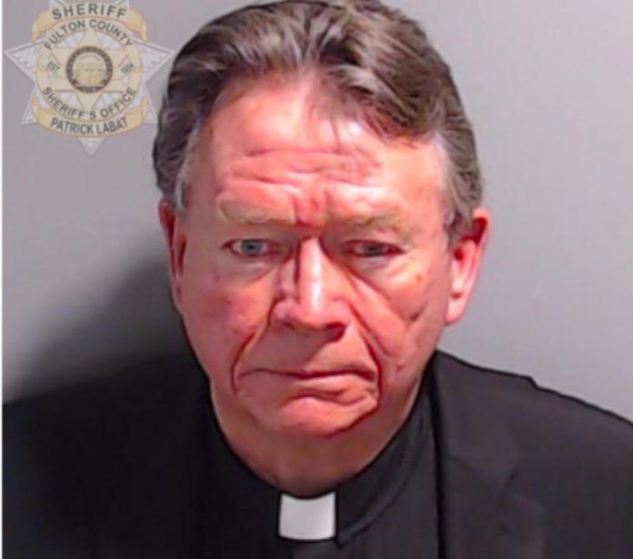 lawfare:-pastor-stephen-cliffgard-lee-turns-himself-in-at-fulton-county-jail-in-georgia-rico-case–-poses-for-mugshot-with-clerical-collar