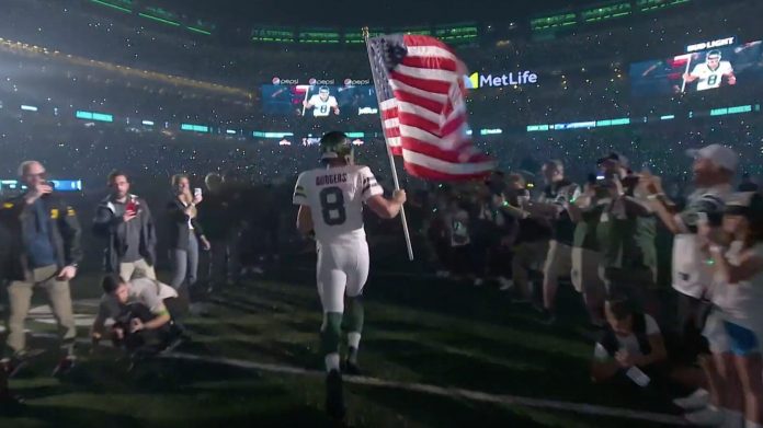 aaron-rodgers-debuts-as-a-jet,-waves-american-flag-on-9/11-anniversary–-a-moment-to-bear-in-mind-(video)