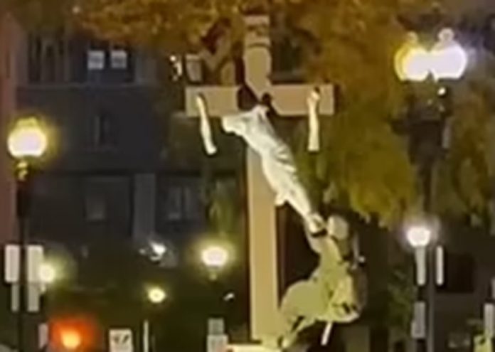 guy-arrested-for-breaking-arms-off-jesus-statue-and-swinging-from-crucifix-outside-boston-church-(video)