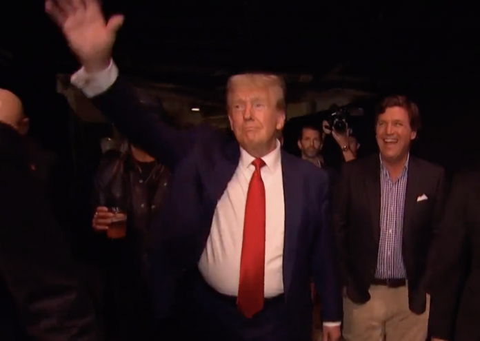 must-see:-crowd-goes-wild-as-president-trump-and-tucker-carlson-walk-into-ufc-295-(video)