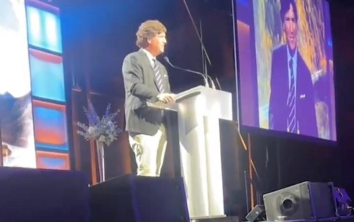 tucker-carlson-criticizes-canada’s-assisted-suicide-program-during-calgary-event,-calls-it-“genocide”-(video)