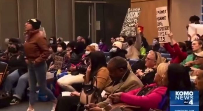 enjoy:-leftist-activists-and-illegals-storm-seattle-city-council-meeting-demanding-more-free-housing,-chanting-“no-more-money-for-the-police,”-“we-need-housing-now”-and-“shame-on-you”–-taxpayers-already-funding-hotels-for-illegals