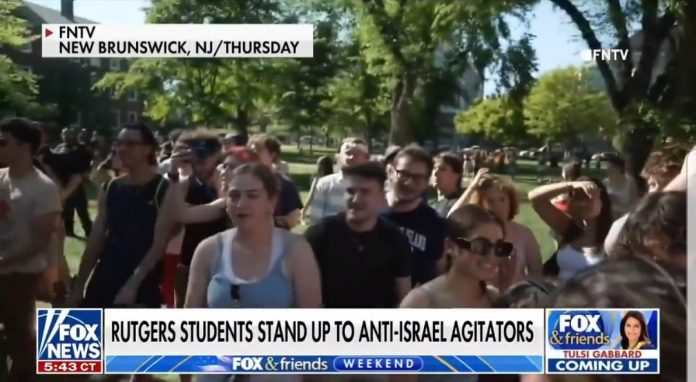 trainees-at-rutgers-university-stand-up-to-anti-american-protests,-wave-american-flags,-sing-national-anthem-(video)