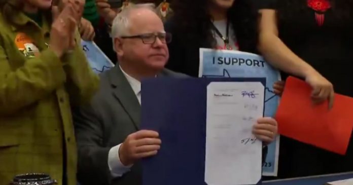 flashback:-vp-pick-tim-walz-smiles-for-cameras-as-he-signs-bill-that-gives-illegal-immigrants-drivers-licenses