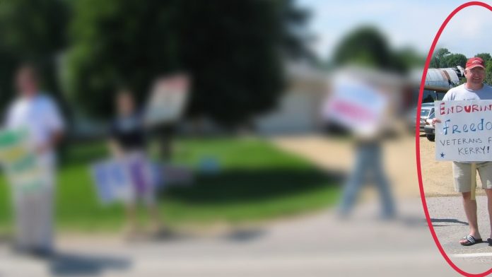 this-should-finish-the-tim-walz-political-career:-picture-unearthed-of-walz-holding-“enduring-freedom-veteran”-protest-sign-–-he-never-served-in-operation-enduring-freedom-–-it-was-all-a-lie