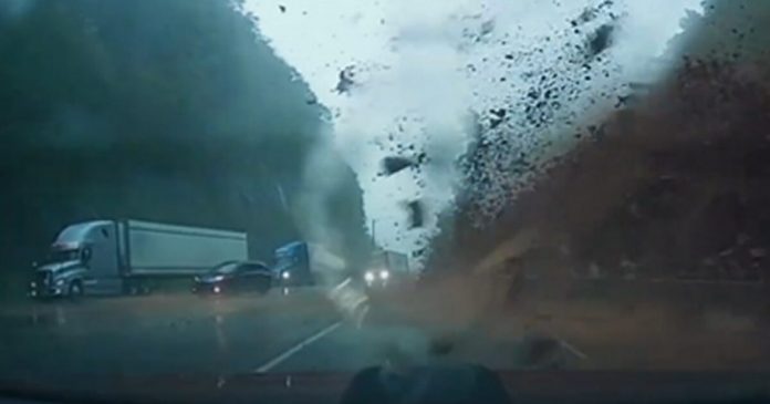 watch-the-terrifying-moment-a-couple-driving-through-the-blue-ridge-mountains-in-north-carolina-barely-missed-a-huge-mudslide-(video)