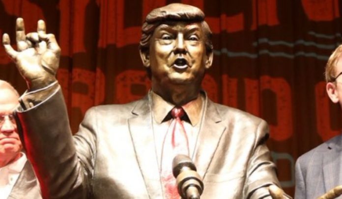 trump-statue-unveiled-in-south-dakota,-leftists-protest-artwork